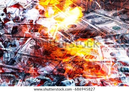 Paper money American dollar bills in bright fire as an illustration of the financial crisis