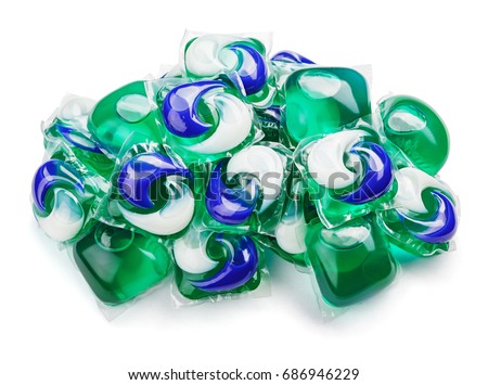 Pile of washing gel capsule pods with laundry detergent isolated on white background with clipping path