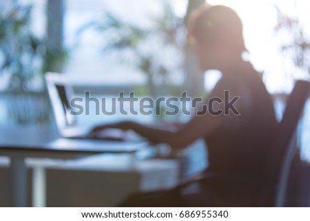 Woman working on laptop at office