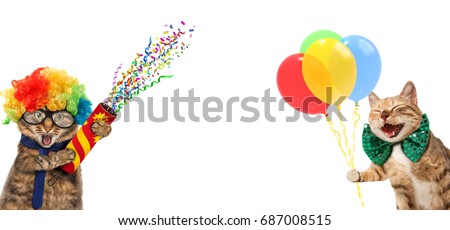 Funny cats are wearing a clown's costume and holding balloons. They are wearing a festival clothes. Royalty-Free Stock Photo #687008515