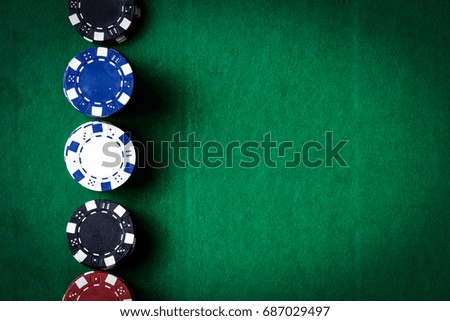 casino chips on green space 