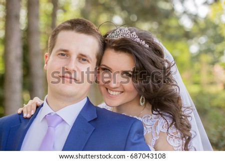 Groom with the bride in the forest