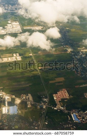 a Aerial view fo city through airplane window
