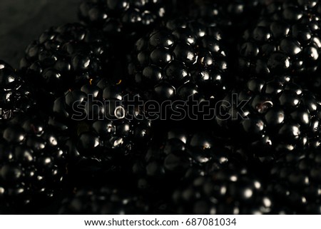 Blueberries and blackberries mix macro dark photo