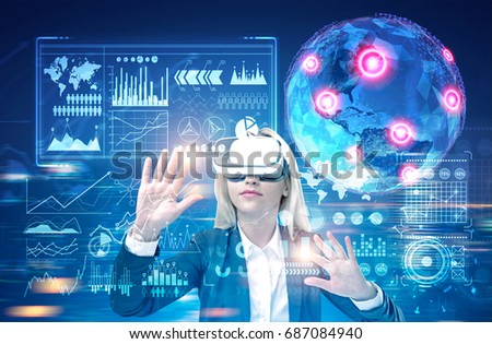 Blonde woman wearing a black suit and VR glasses is interacting with an Earth hologram and infographics in futuristic surrounding. Toned image double exposure. Elements of this image furnished by NASA