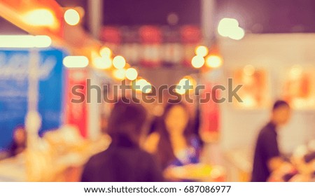 Abstract blur image of Shopping mall or Exhibition hall  with bokeh for background usage . (vintage tone)