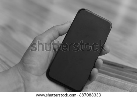 Black smart phone in black tone.