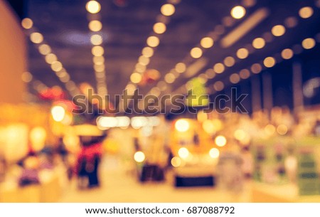 Abstract blur image of Shopping mall or Exhibition hall  with bokeh for background usage . (vintage tone)