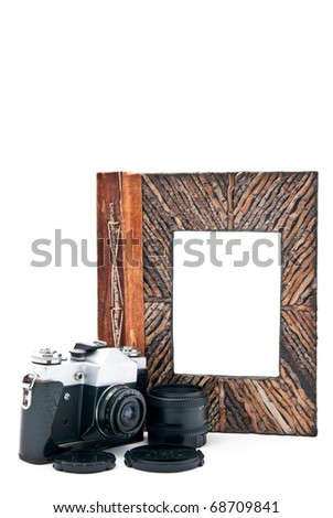 Vintage camera  and photo album with empty picture. Isolated on white