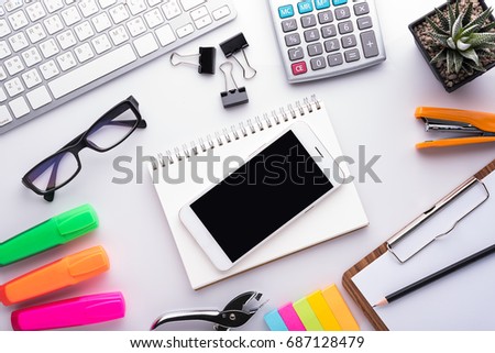 White office desk table with school accessories with office supplies. Top view with copy space