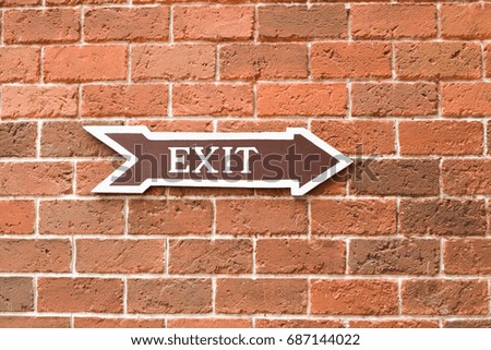 Exit sign on brick wall