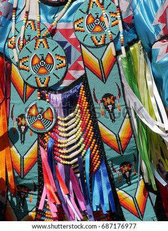 Closeup of native american costume worn by street performer.