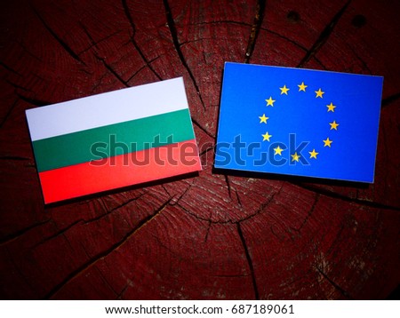 Bulgarian flag with EU flag on a tree stump isolated