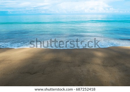 Blue sea and brown sand