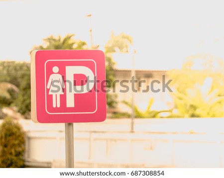 Lady Parking Sign, Reserved Car Park with morning sunlight.