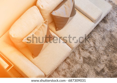 contemporary interior of Living room with part of sofa in sunny day interior background concept