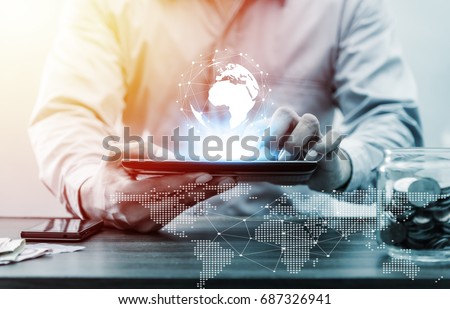 Technology people global network and online banking internet banking phone, cellphone, tablet, mobile banking, online payment concept, Business man with laptop and earth and Credit by NASA Royalty-Free Stock Photo #687326941