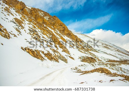 Khardung La pass, India. Khardung La is a high mountain pass located in the Ladakh region of the Indian state of Jammu and Kashmir. The elevation of Khardung La is 5,359 m.