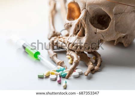 Skull model, Hand bones and Dangerous drugs that affect health.