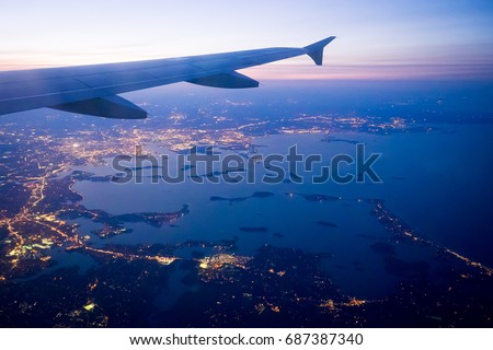 Boston and the coast of New England as seen from an airplane approach Logan Airport. Royalty-Free Stock Photo #687387340