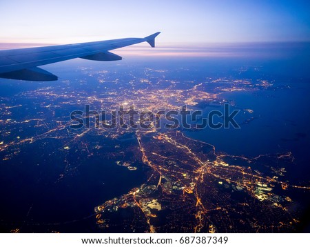 Boston and the coast of New England as seen from an airplane approach Logan Airport. Royalty-Free Stock Photo #687387349
