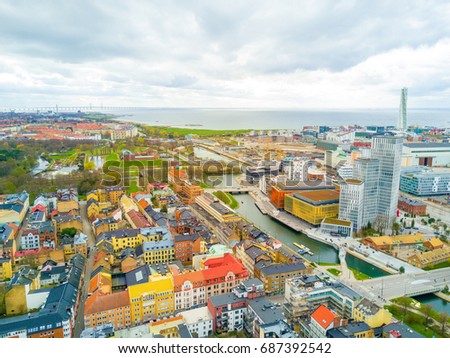 Aerial Malmo city view from above with harbour, turning Torso and the bridge over the canal. Royalty-Free Stock Photo #687392542