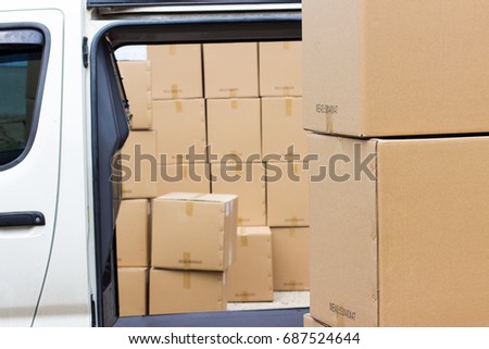 Cargo in cardboard boxes ready to be transported by car