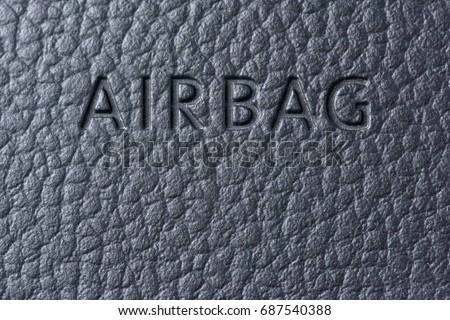 Inscription airbag on the steering wheel in the car very close-up