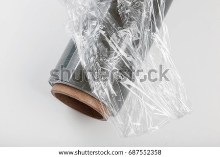 wrapping plastic transparent food film on white background. 