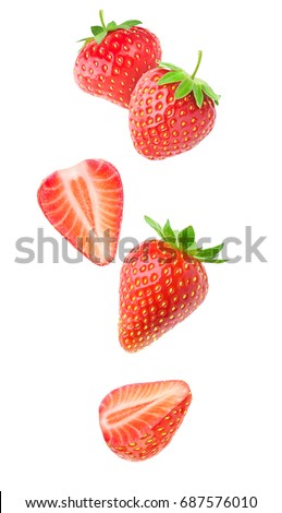 Isolated strawberries. Falling strawberry fruits whole and cut in half isolated on white background with clipping path Royalty-Free Stock Photo #687576010