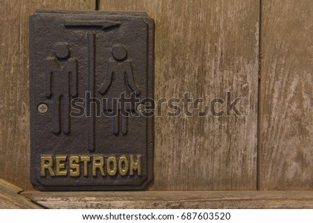 symbol restroom or toilet old wood texture background