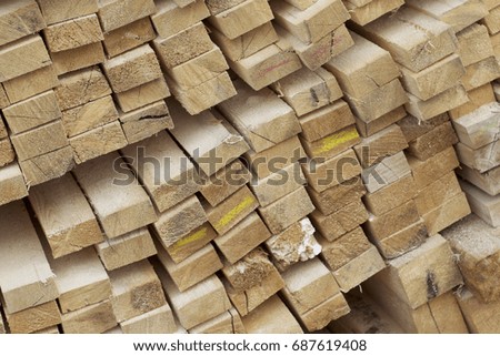 Sawn wooden boards and bars in a pack in stock, Russia