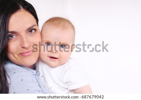 Little cute baby on mother's hand. Happy motherhood concept