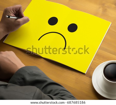 Depressive emotions concept,   smiley face emoticon printed depression and sad pessimistic face sadness