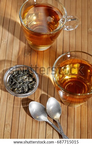 Detox food & drink healthy lifestyle concept. Cap of tea. Fresh green tea. Bamboo background. Close. Closeup. Top view.