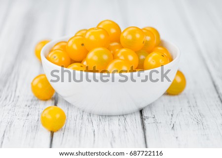 Yellow Tomatoes on a vintage background as detailed close-up shot, selective focus