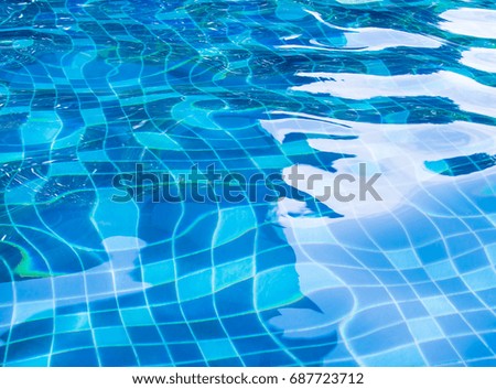 Background of rippled water in swimming pool / Blue ripped water in swimming pool
