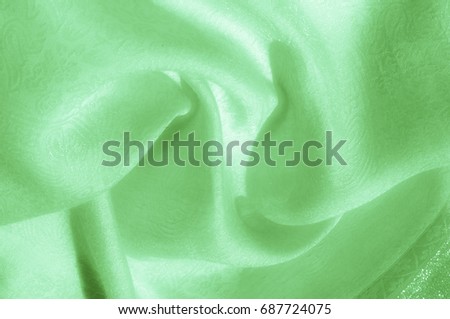 Texture, background, pattern. Fabric - silk light. Pale green fabric. Beautiful picture. 