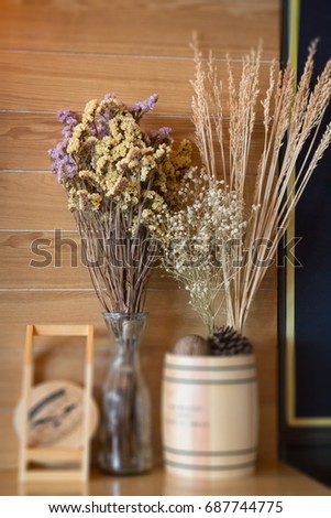 Ornamental basket of wheat on wooden table, stock photo