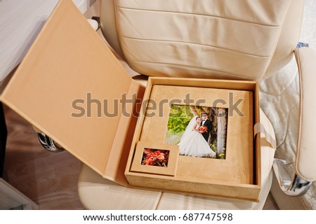 Brown box of the wedding photobook or photo album.