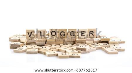 Vlogger on word tiles over a white background