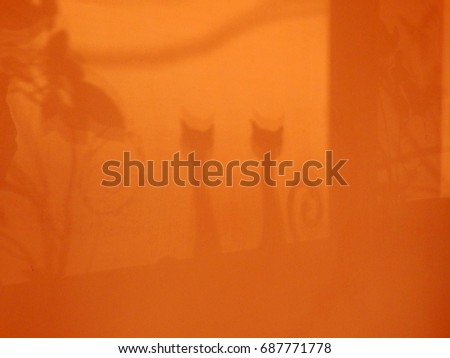 cartoon cats shadows on the wall