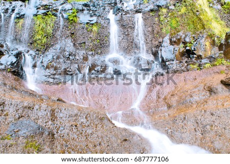 Flowing water and rock texture in the mountains of Madeira