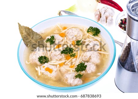 Broth with vermicelli and meatballs in a plate. Studio Photo
