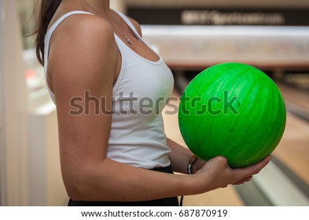 Green bowling ball in the bowling center
