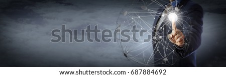 Blue chip manager activating a globe shape network high above the clouds. Information technology concept for global communications, computer network and remote access. Copy space on panoramic banner.