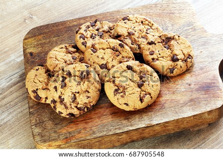Chocolate cookies on wooden table. Chocolate chip cookies shot