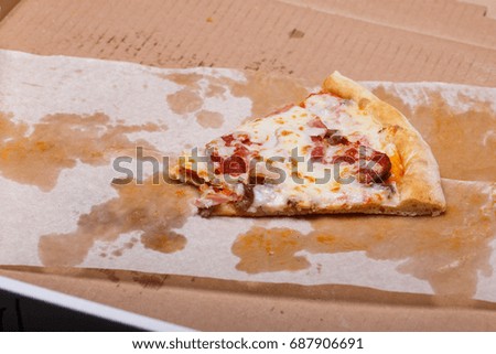 Meat pizza on a dark wooden background