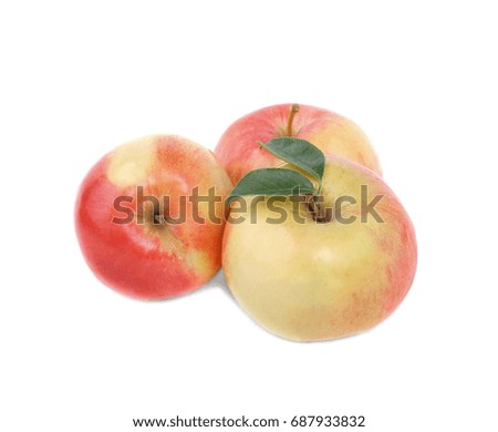 A close-up picture of three whole apples isolated over the white background. A group of three colorful and fresh apples. Nutritious and healthful breakfasts and snacks. Tasty summer fruits. 