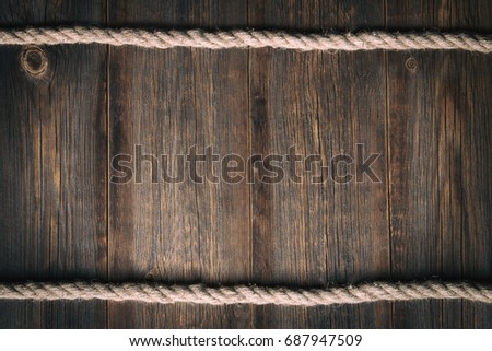 Wooden vintage background with a sea rope
